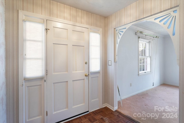 foyer with parquet flooring