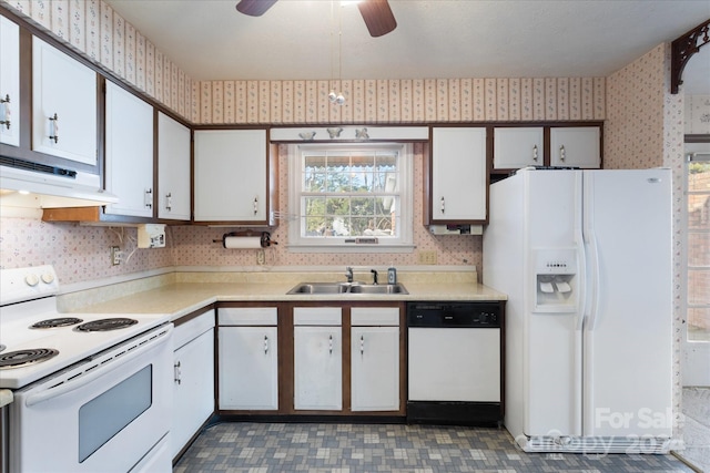 kitchen with white appliances, sink, ceiling fan, white cabinetry, and extractor fan