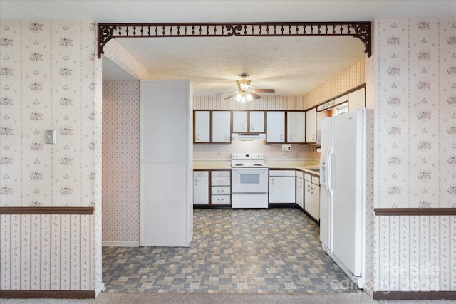 kitchen with white cabinets, a textured ceiling, white appliances, and ceiling fan