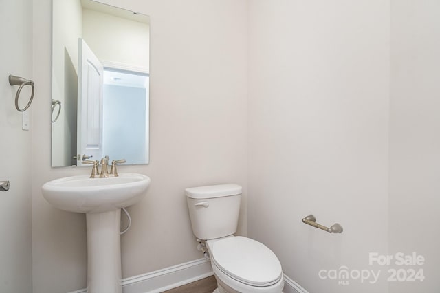 bathroom with toilet and sink