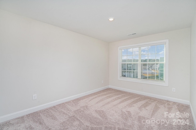 unfurnished room with carpet