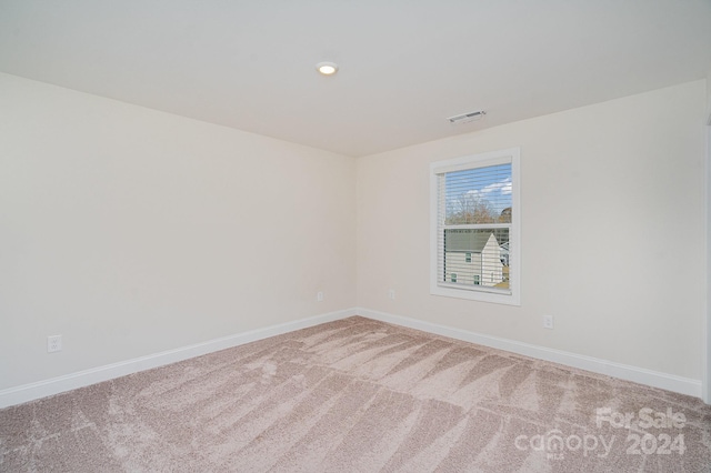 unfurnished room with carpet floors