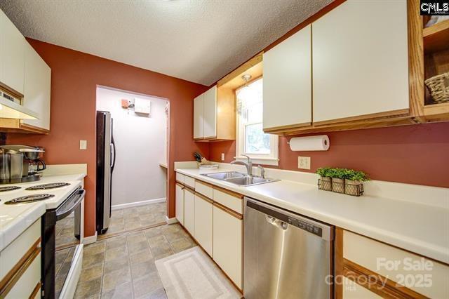 kitchen featuring white range with electric cooktop, light countertops, white cabinets, a sink, and dishwasher