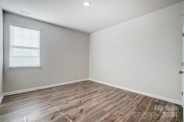 unfurnished room featuring light hardwood / wood-style flooring