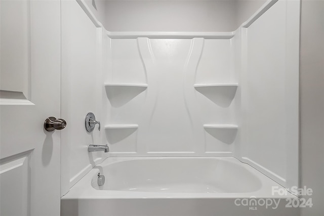 bathroom featuring washtub / shower combination