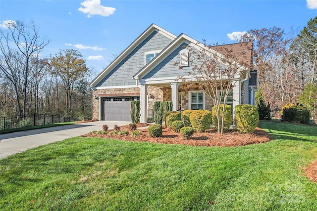 view of front of property with a garage and a front yard