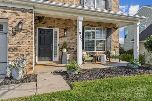 property entrance featuring covered porch