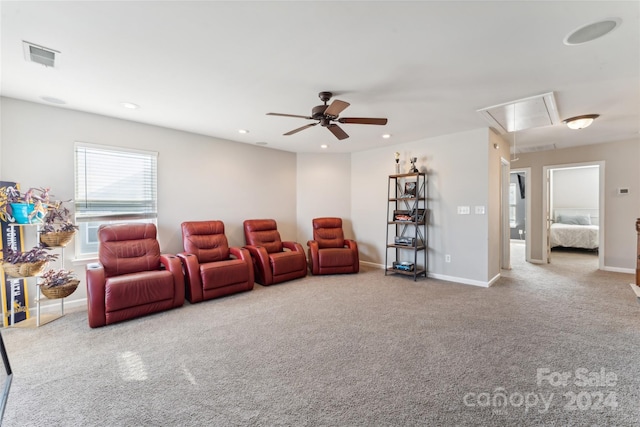 carpeted cinema with ceiling fan