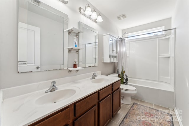 full bathroom featuring tile patterned flooring, vanity, toilet, and shower / tub combo with curtain