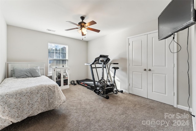 carpeted bedroom with ceiling fan