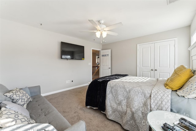 bedroom with ceiling fan, carpet floors, and a closet