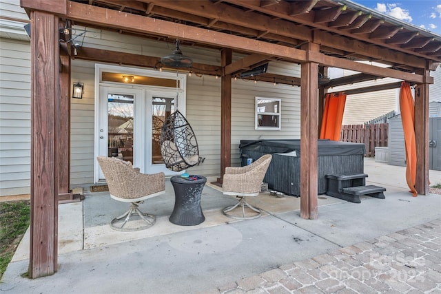 view of patio / terrace with a hot tub