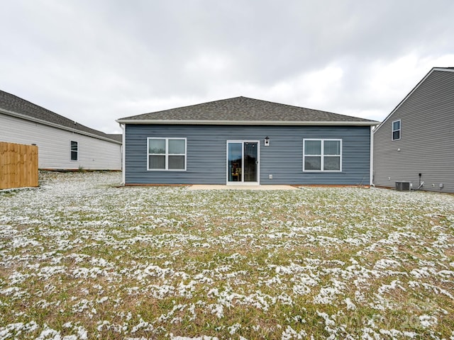 snow covered property featuring a patio area and central air condition unit