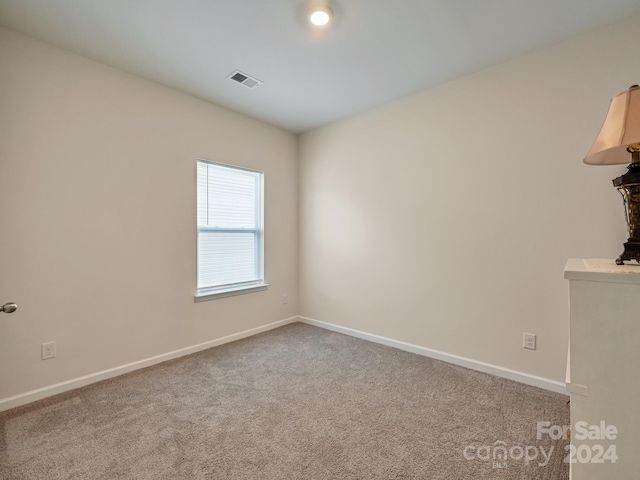 unfurnished room with carpet floors