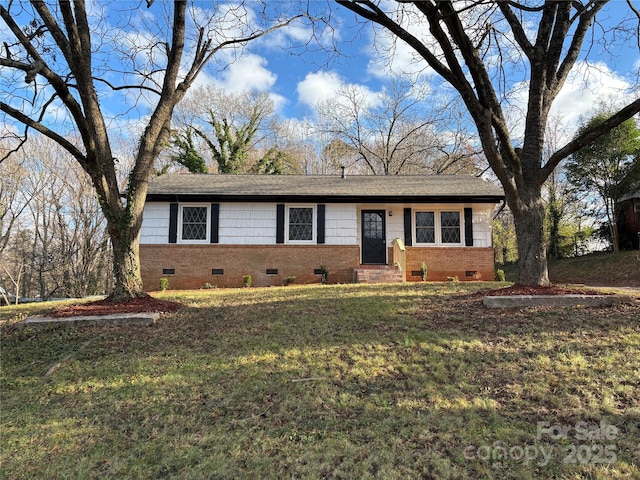 ranch-style home with a front lawn