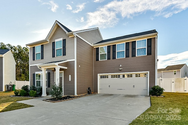 view of front of home with a garage and a front lawn