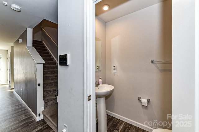 bathroom with hardwood / wood-style floors