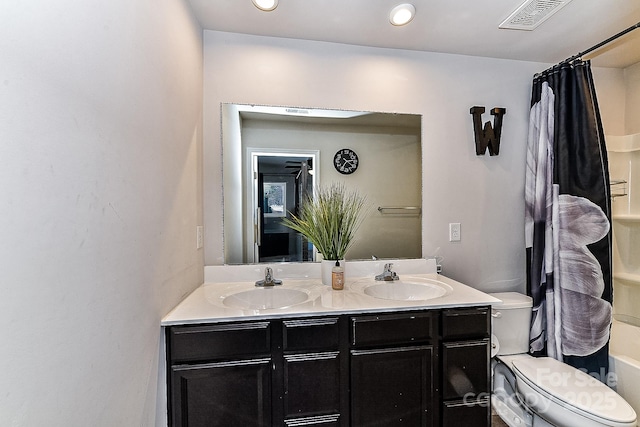 bathroom with vanity and toilet