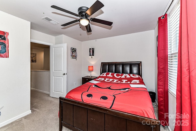 bedroom with ceiling fan and light colored carpet