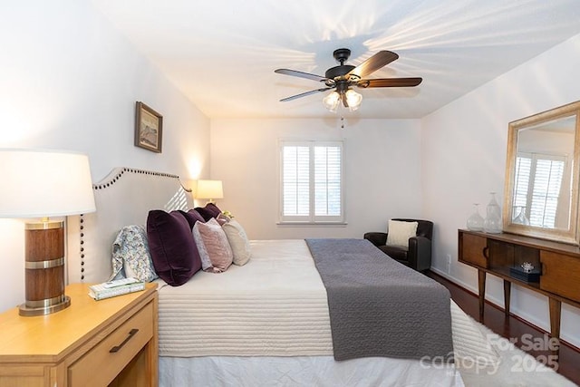 bedroom with ceiling fan and light hardwood / wood-style flooring