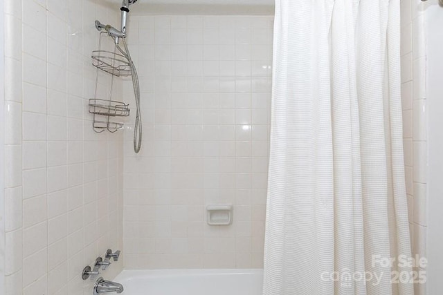 bathroom featuring shower / bath combination with curtain