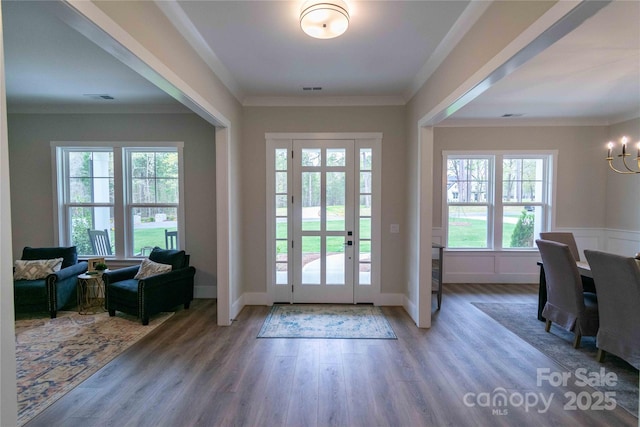 1875 Rock Hill Church Rd Unit 4, Matthews, NC 28104 - entrance foyer with a chandelier, plenty of natural light, wood finished floors, and ornamental molding