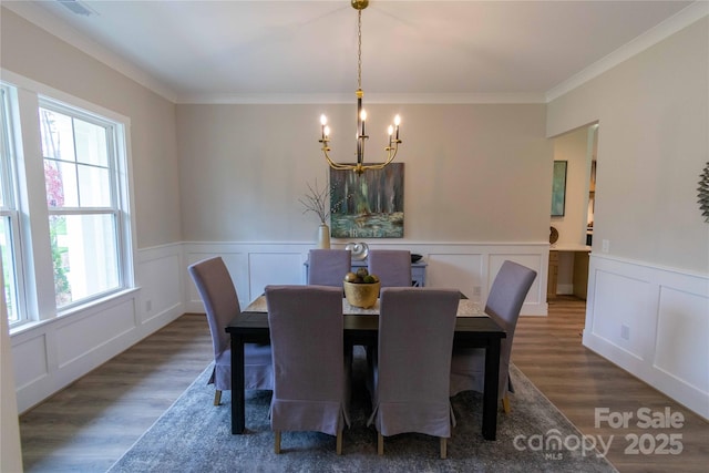 1875 Rock Hill Church Rd Unit 4, Matthews, NC 28104 - dining space with a chandelier, a decorative wall, wood finished floors, ornamental molding, and a wainscoted wall