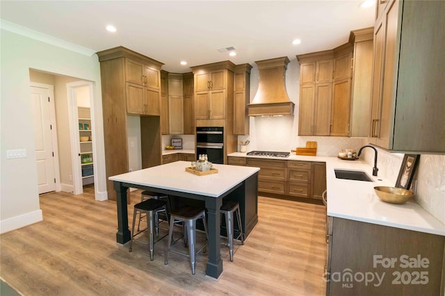 1875 Rock Hill Church Rd Unit 4, Matthews, NC 28104 - kitchen featuring custom exhaust hood, a kitchen bar, stainless steel appliances, light countertops, and recessed lighting
