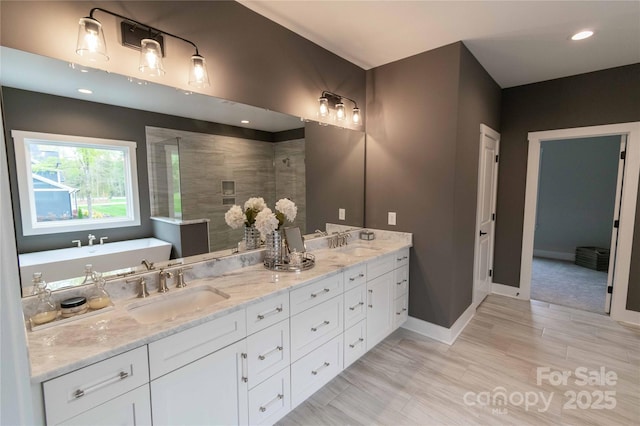 1875 Rock Hill Church Rd Unit 4, Matthews, NC 28104 - bathroom featuring double vanity, tiled shower, and a freestanding bath