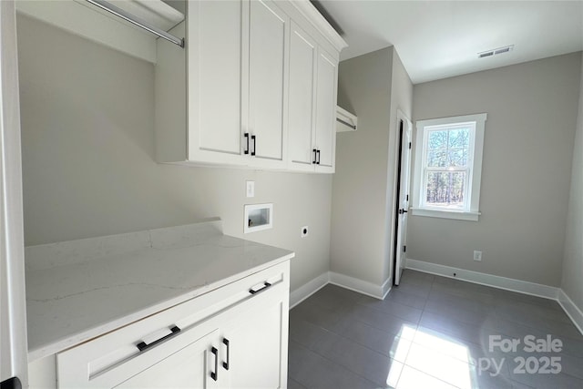 1875 Rock Hill Church Rd Unit 4, Matthews, NC 28104 - laundry room featuring hookup for a washing machine, hookup for an electric dryer, dark tile patterned flooring, and cabinet space