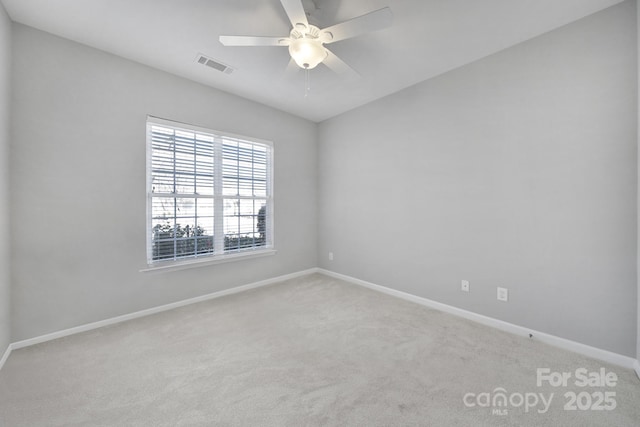 unfurnished room featuring light carpet and ceiling fan