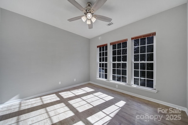 unfurnished room featuring ceiling fan and light hardwood / wood-style flooring