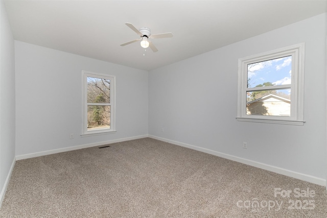 carpeted empty room with ceiling fan