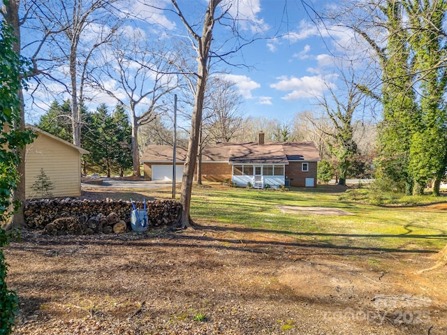 view of yard with a garage