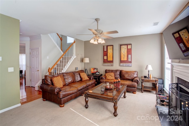 living room with ceiling fan and hardwood / wood-style flooring