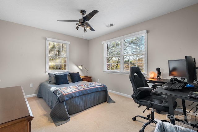 bedroom featuring ceiling fan and light colored carpet