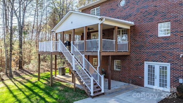 back of property featuring ceiling fan, cooling unit, and a patio area