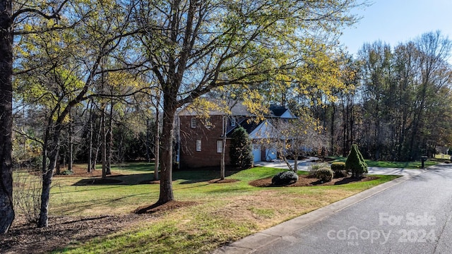 view of property exterior with a yard