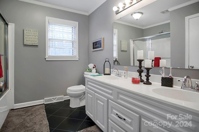 full bathroom with tile patterned flooring, crown molding, bath / shower combo with glass door, toilet, and vanity