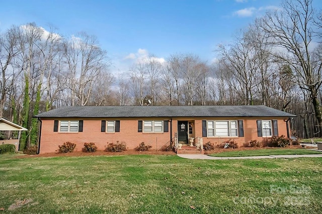 ranch-style house with brick siding and a front yard