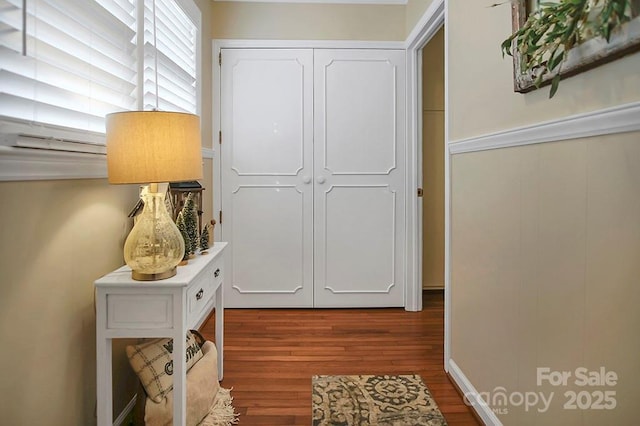 corridor featuring wood finished floors