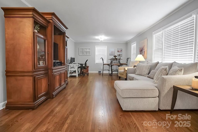 living room with baseboards, dark wood finished floors, and crown molding