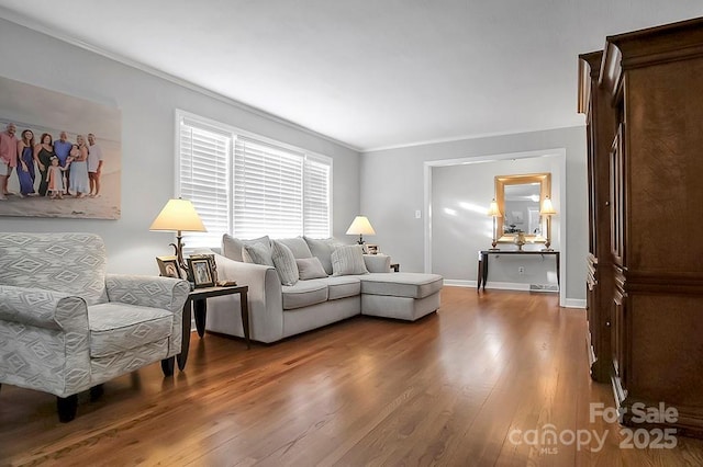 living area featuring wood finished floors and baseboards