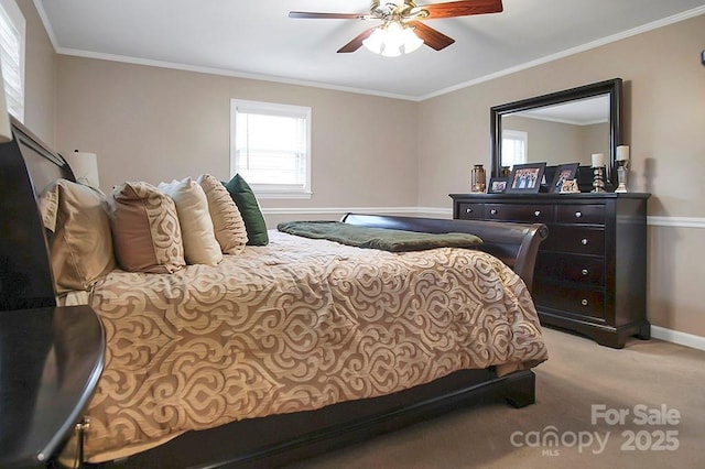 bedroom featuring ornamental molding, carpet, baseboards, and a ceiling fan