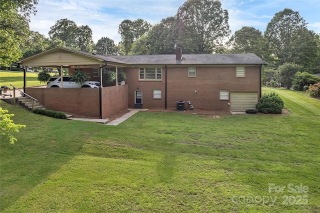216 Delview Dr, Cherryville, NC 28021 - back of property with an attached carport, a lawn, a chimney, and brick siding
