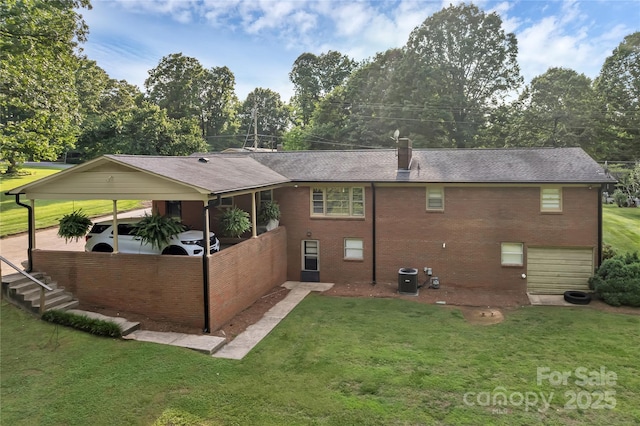216 Delview Dr, Cherryville, NC 28021 - rear view of house featuring a yard, brick siding, a chimney, roof with shingles, and view of wooded area