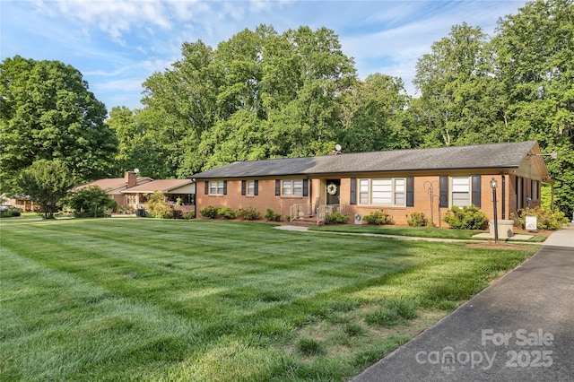 216 Delview Dr, Cherryville, NC 28021 - ranch-style home featuring a front yard and brick siding
