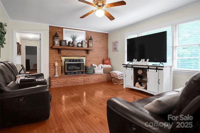 216 Delview Dr, Cherryville, NC 28021 - living room featuring a ceiling fan, hardwood / wood-style floors, and a fireplace