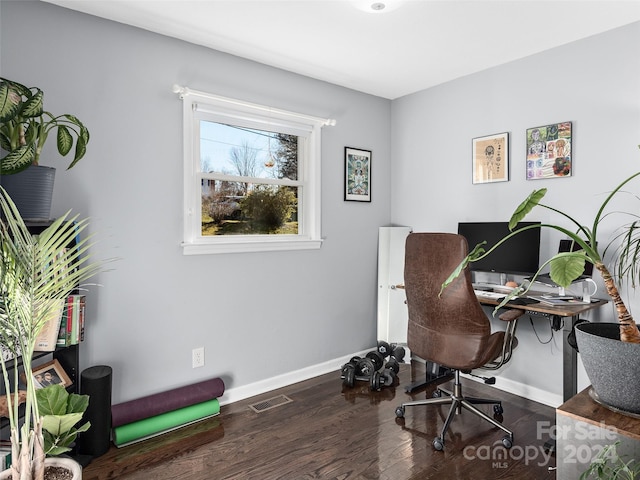 home office with dark wood-type flooring