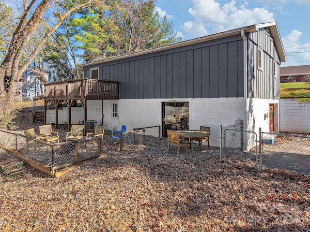 back of property with a wooden deck